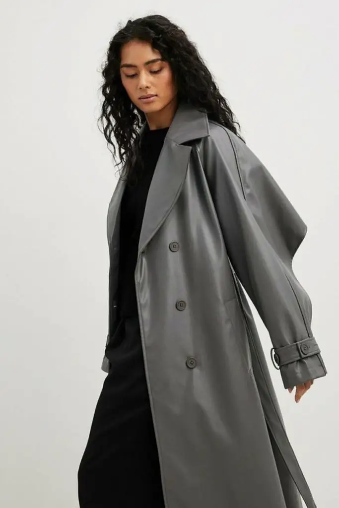 Silver trench with leather leggings.