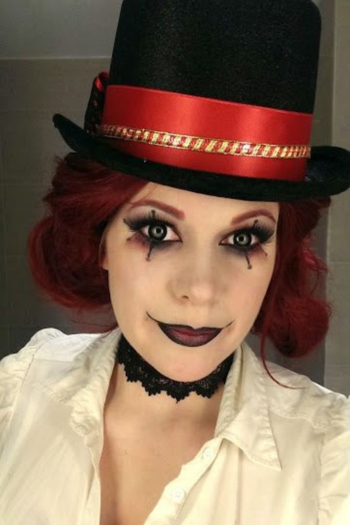 Circus ringmaster with crimson curled mane.