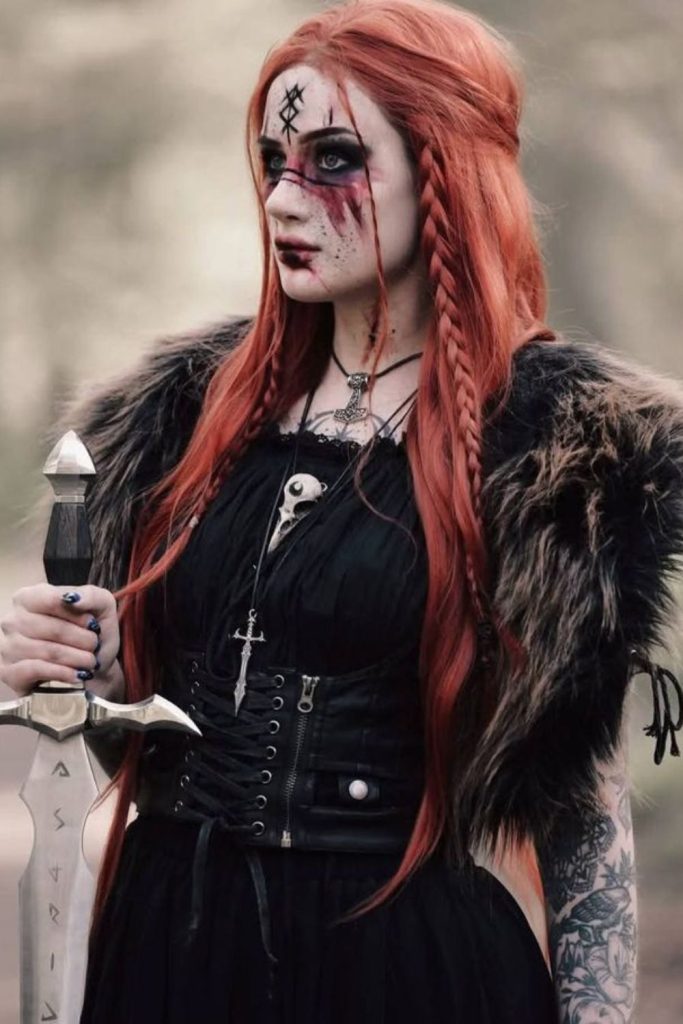Demon valkyrie with scarlet braids.