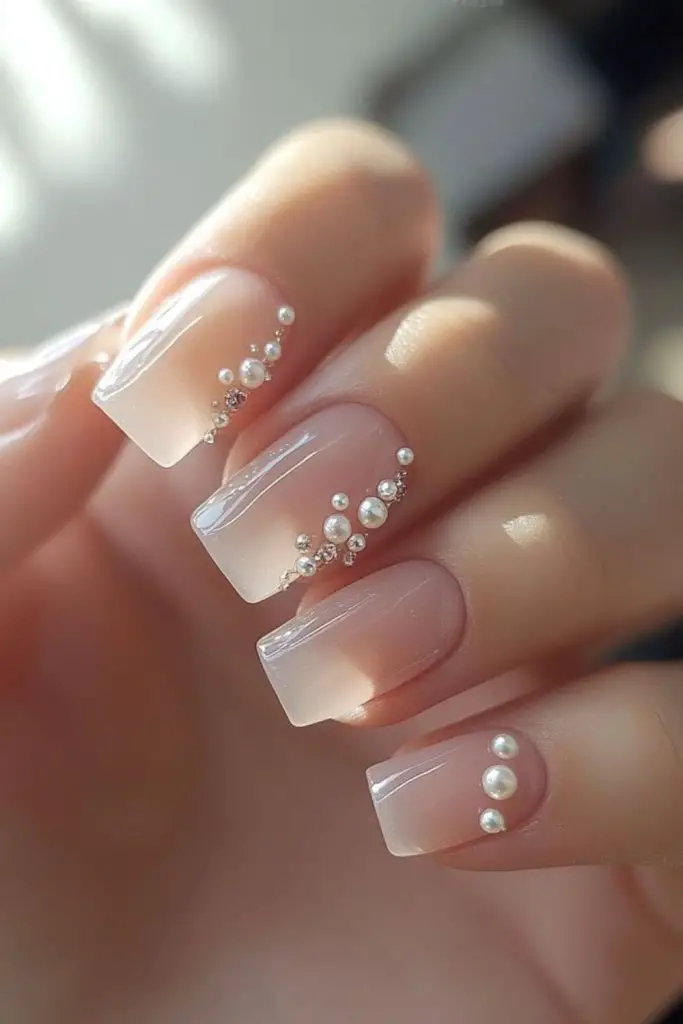 Crystal bow accent sweet wedding nails.