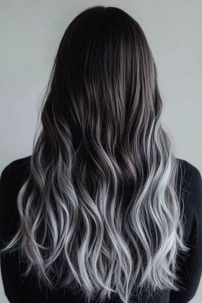 Frosted silver cascading dark hair balayage