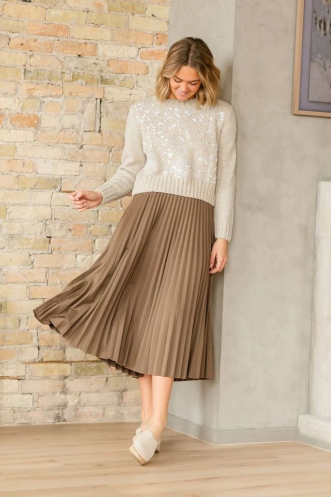Fawn knit sweater flowing skirt ensemble.