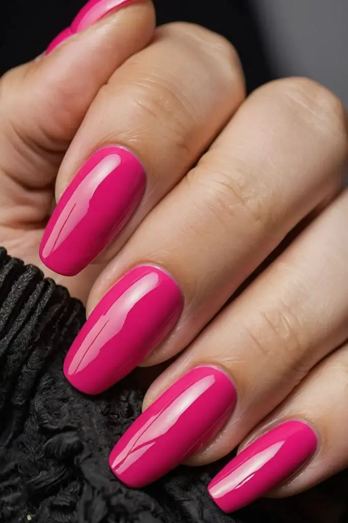 Flamingo pink bold glossy nails.
