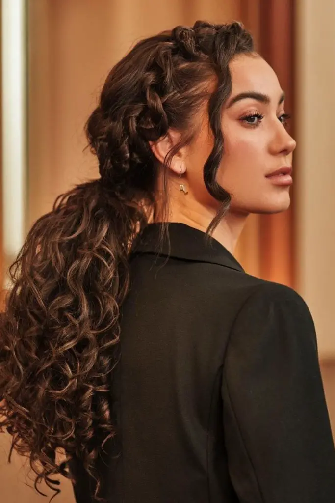 Low side ponytail with floating curls