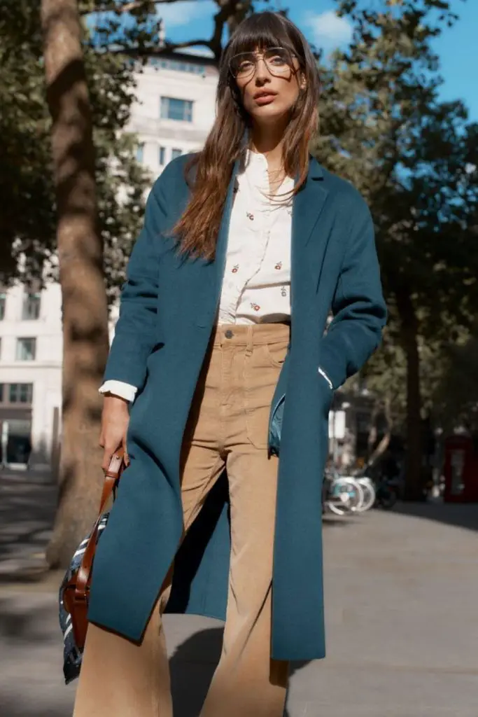 Blue coat with corduroy trousers.