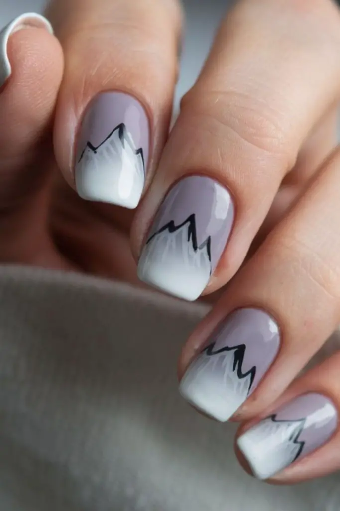 Gray nails white mountain peak winter