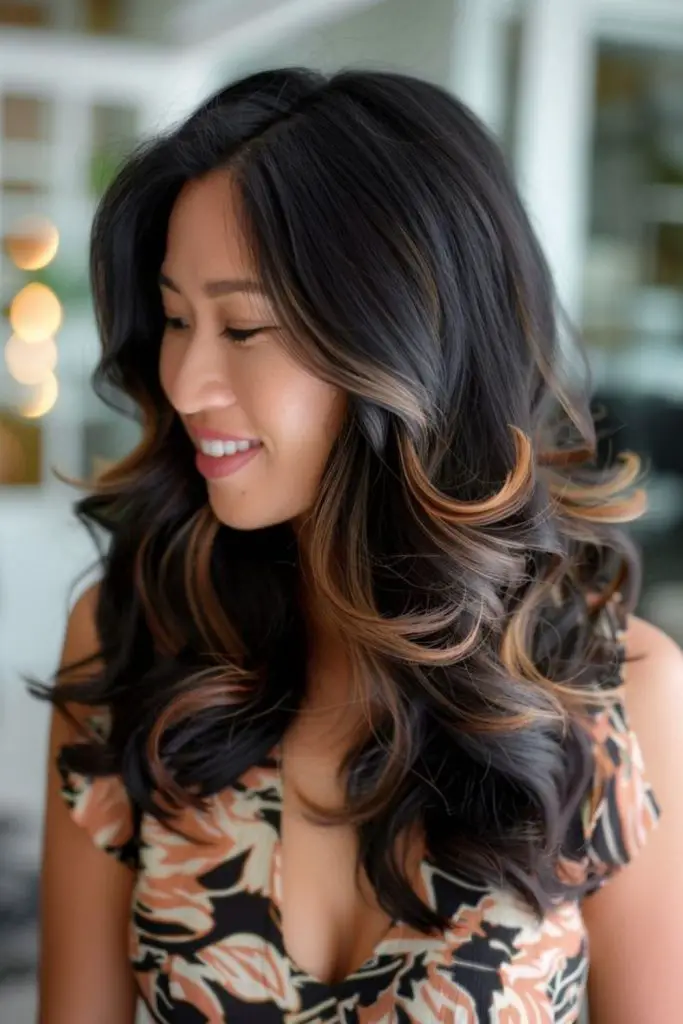 Golden ember balayage on black hair.