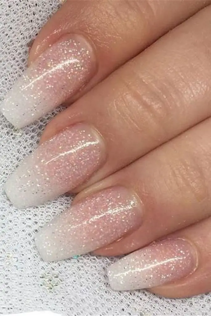 Ivory chrome radiant bridal nail design.