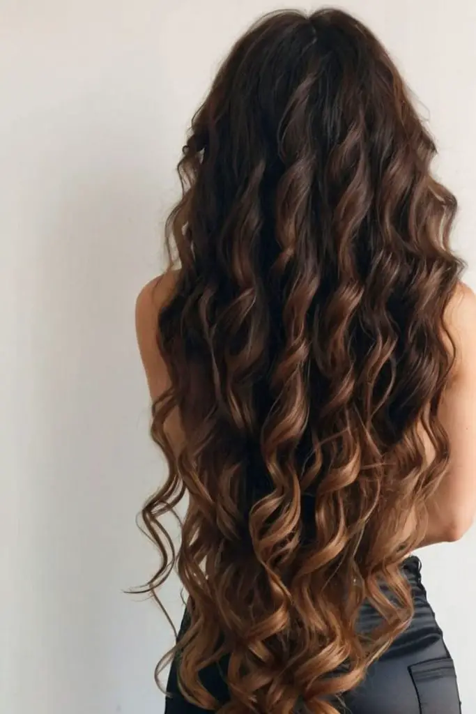 Long glossy curls like melting lava