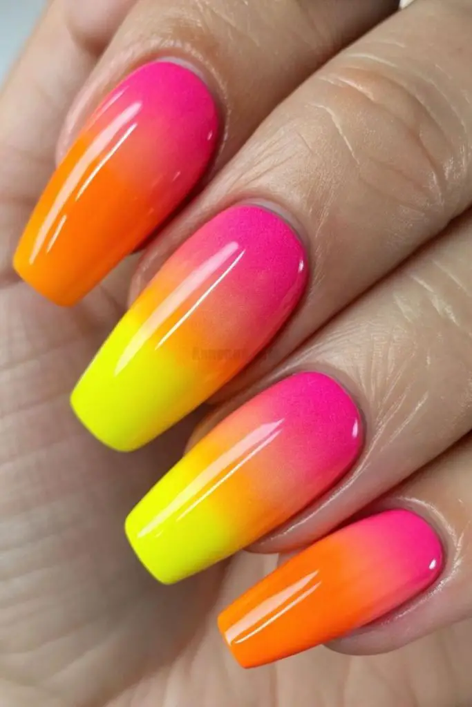 Neon sunset gradient glow nails.