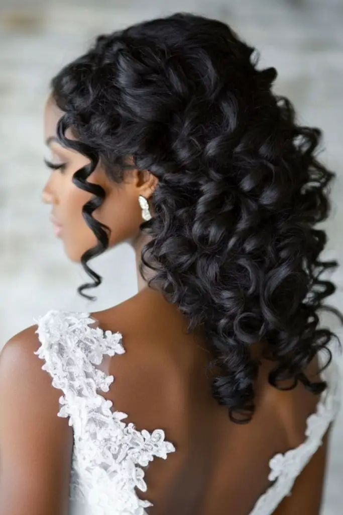 Pinned curls cascading bridal hairstyle