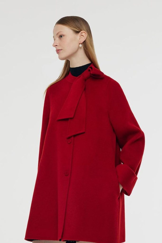 Bold red overcoat dramatic fall outfit.
