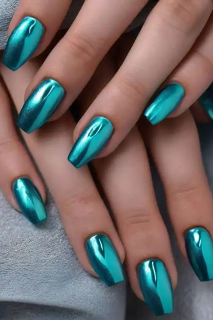 Shimmering lagoon teal ocean nails.