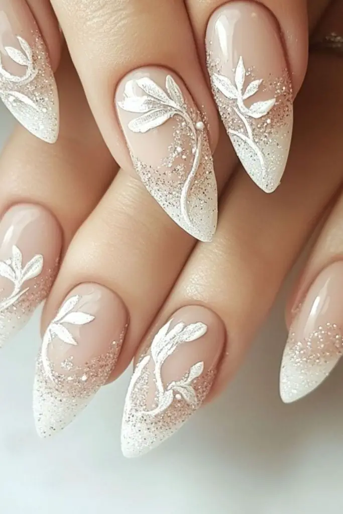 Silver leaf adorned bridal nail design.