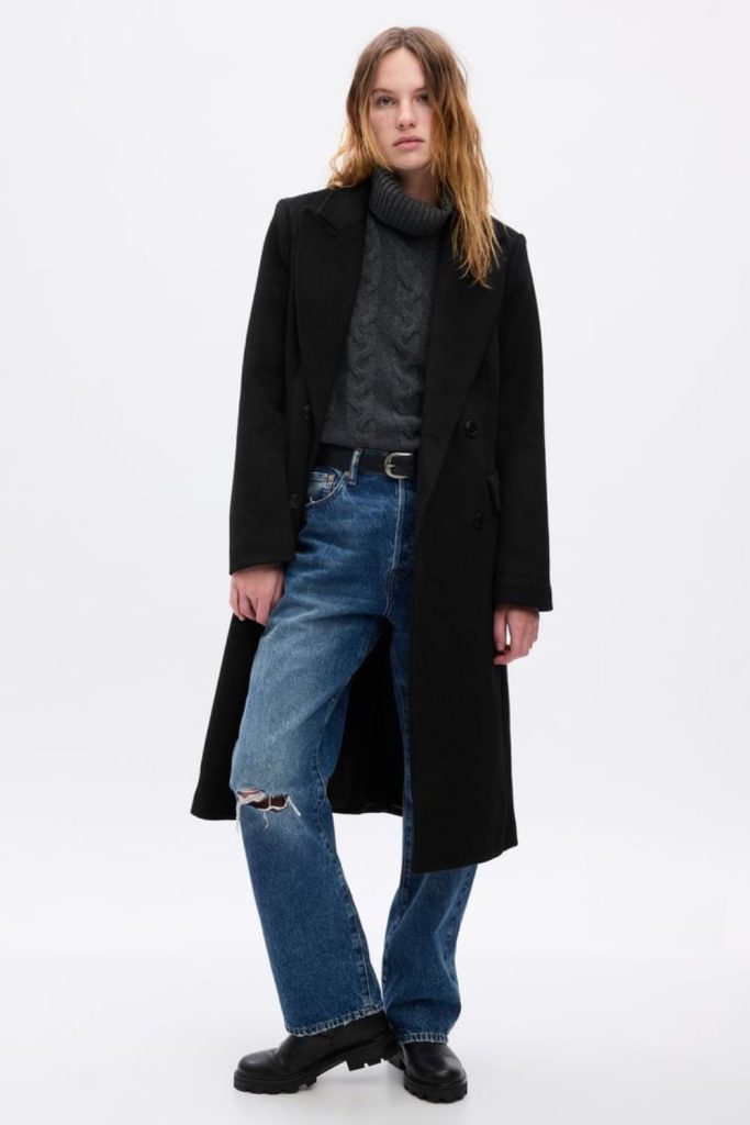 Black coat over deconstructed flannel.
