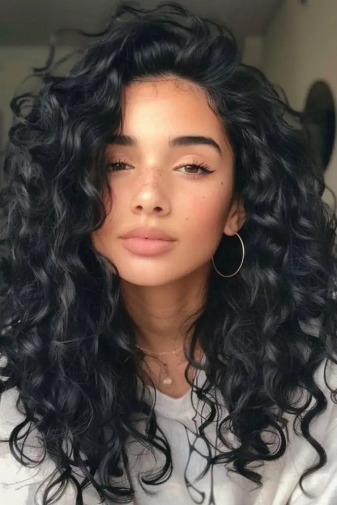 Voluminous halo of tight spiral curls