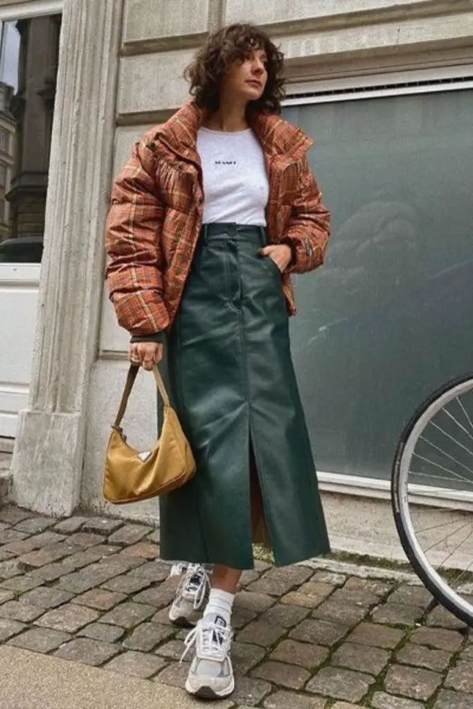Two-tone puffer with leather skirt.
