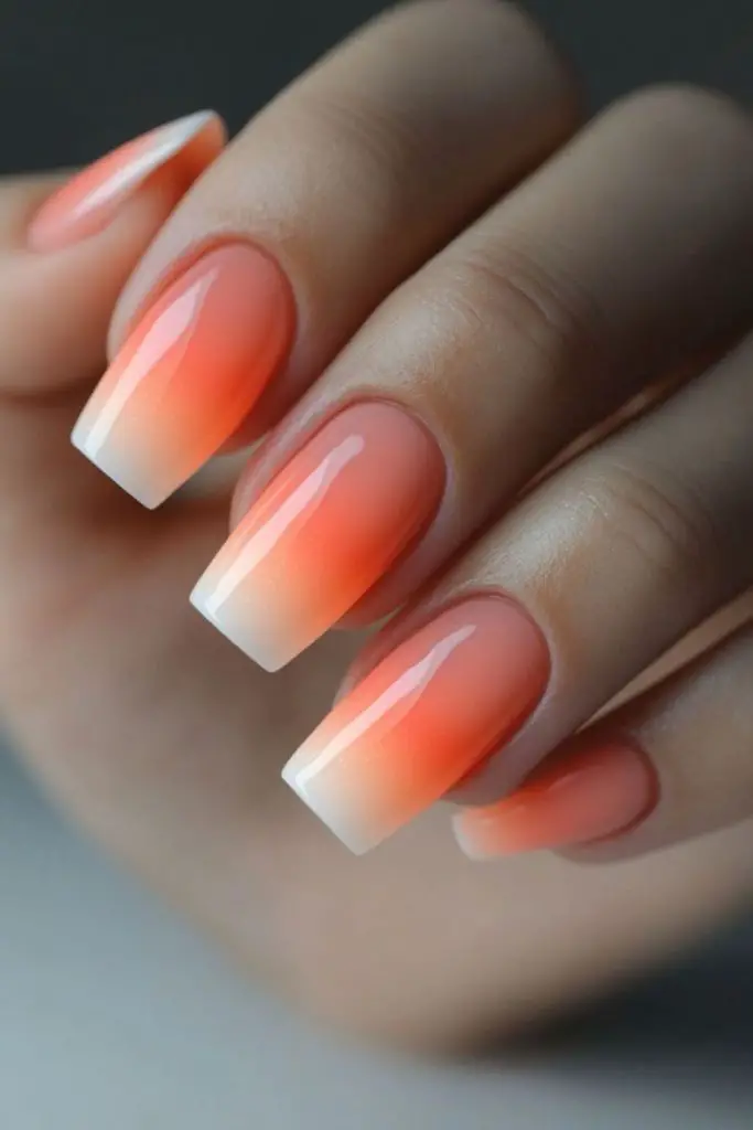 Sunset ombre glowing gradient manicure.