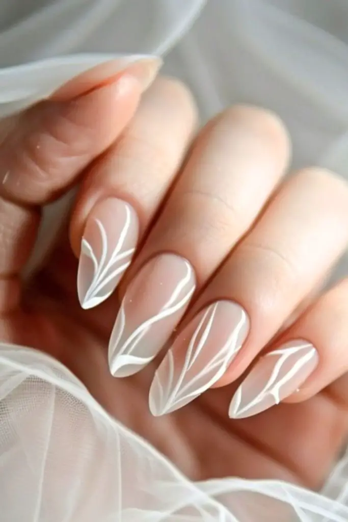 Swan feather softness delicate wedding nails.