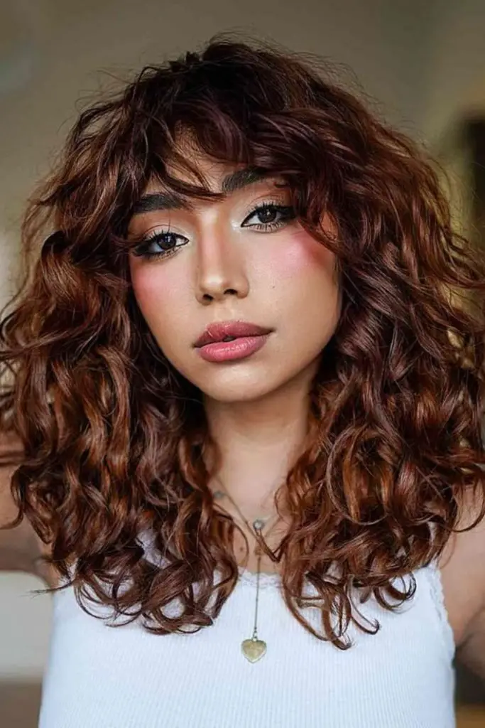 Curly lob with swoop fringe
