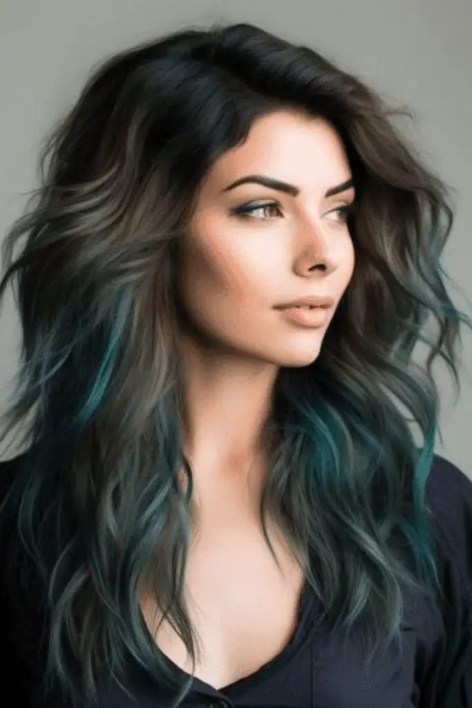 Dark brunette hair with teal streaks