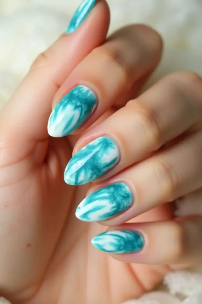 Teal storm marble swirl nails.