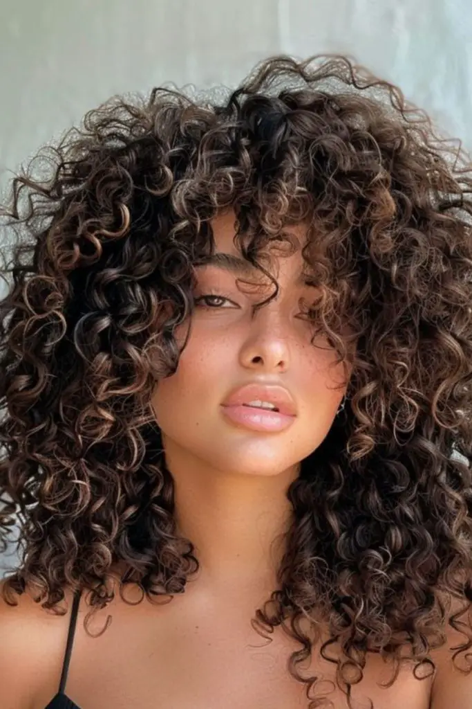 Untamed layered curly afro style