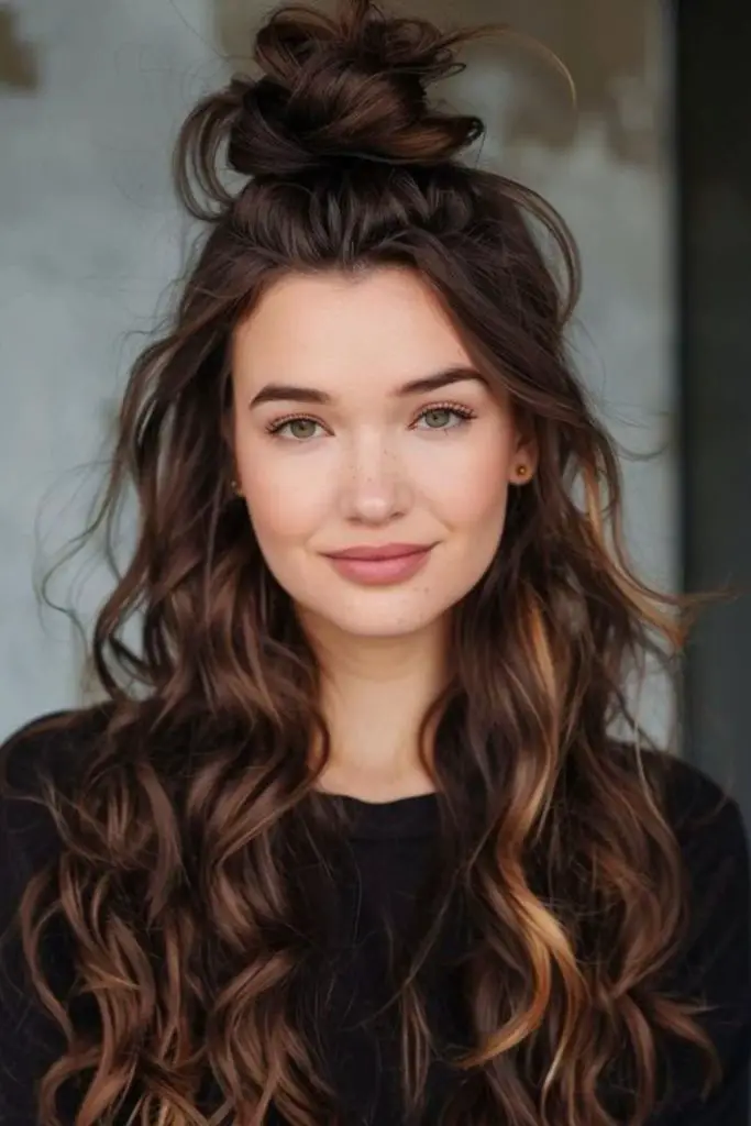 Windblown top knot with loose curls