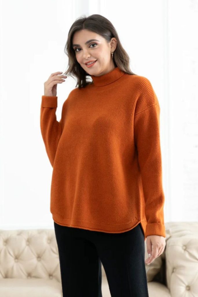 Auburn turtleneck sweater and dark denim