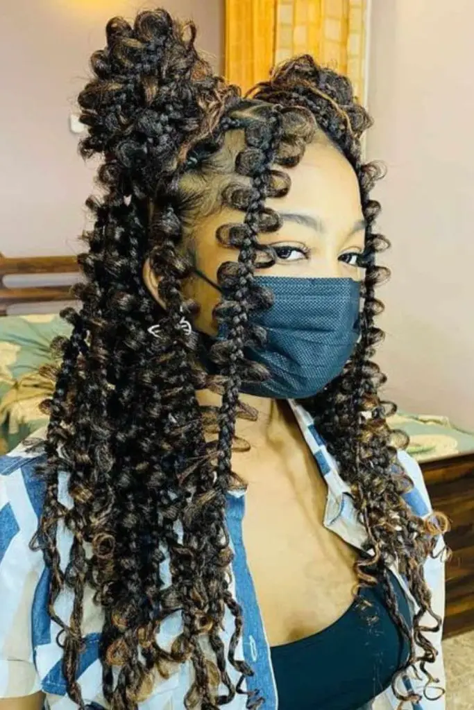 Butterfly loc braids with boho vibes