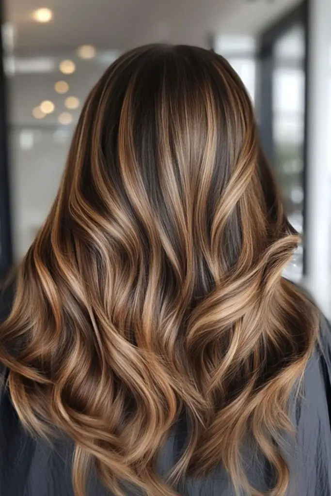 Caramel ribbon highlights on ebony hair