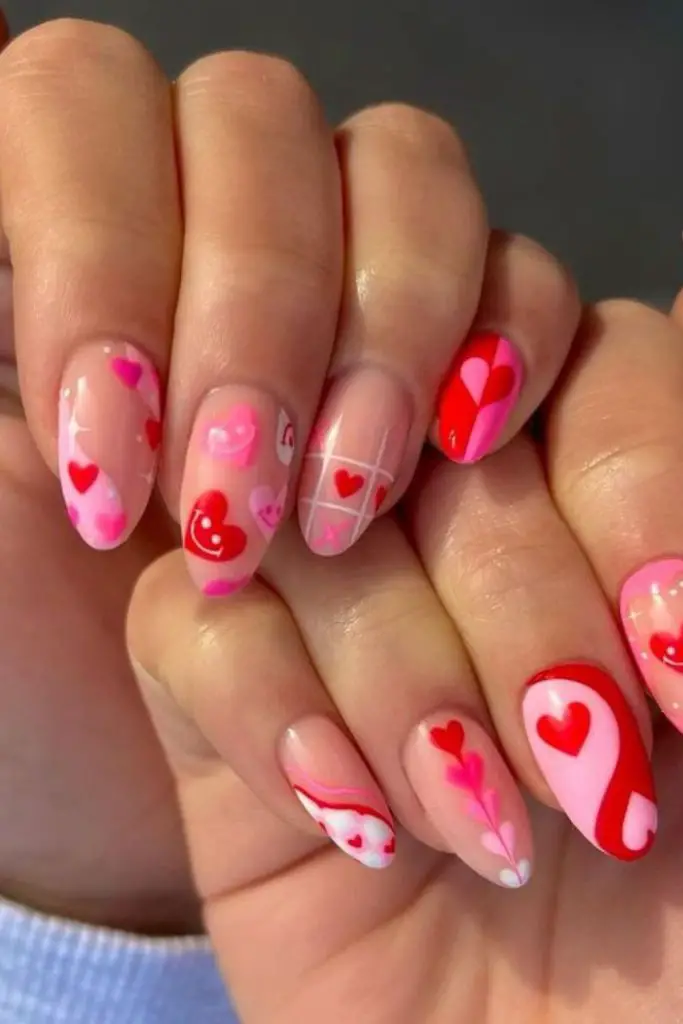 Cherry nails with rainbow accent streaks