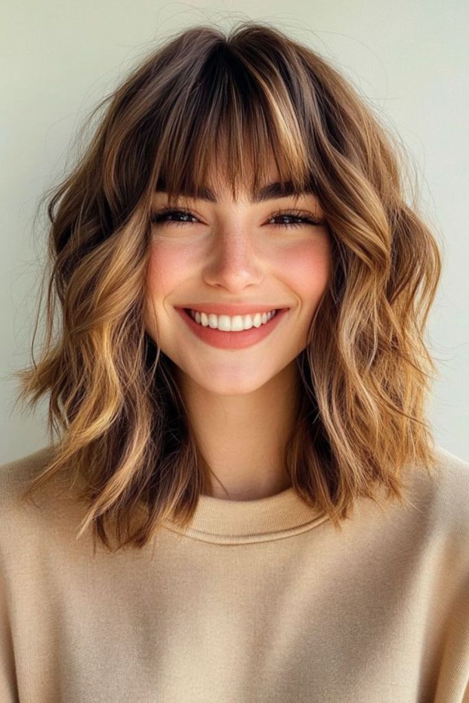 Choppy wavy lob with piecey bangs