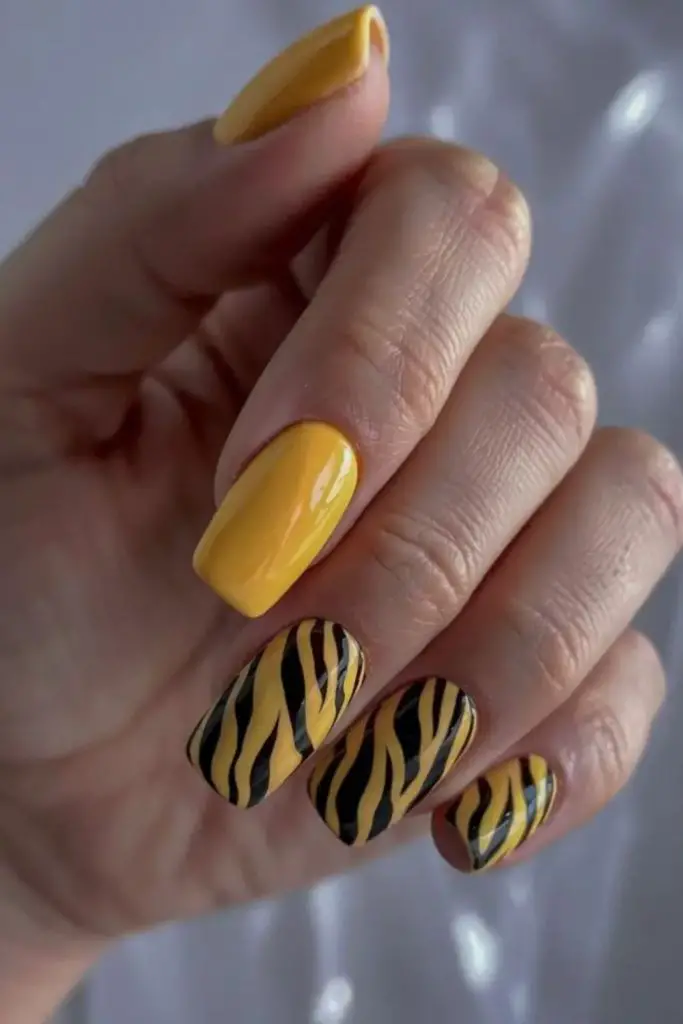 Neon yellow zigzag patterned nails