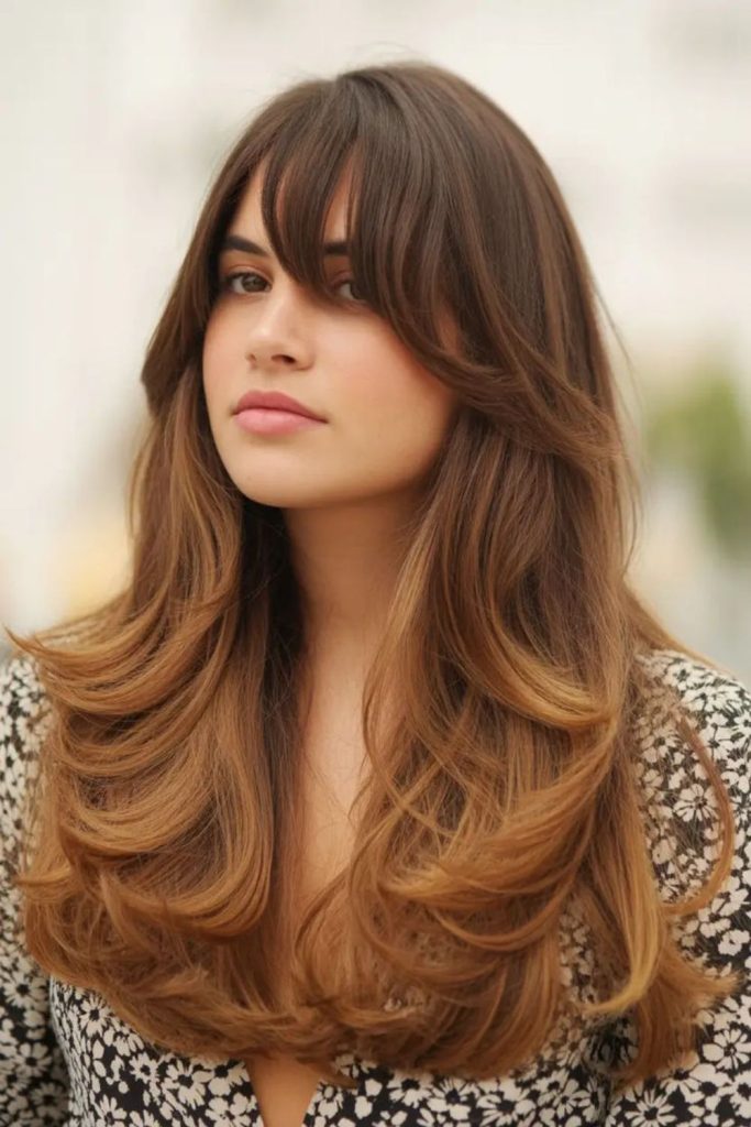 Long layered haircut framing round faces