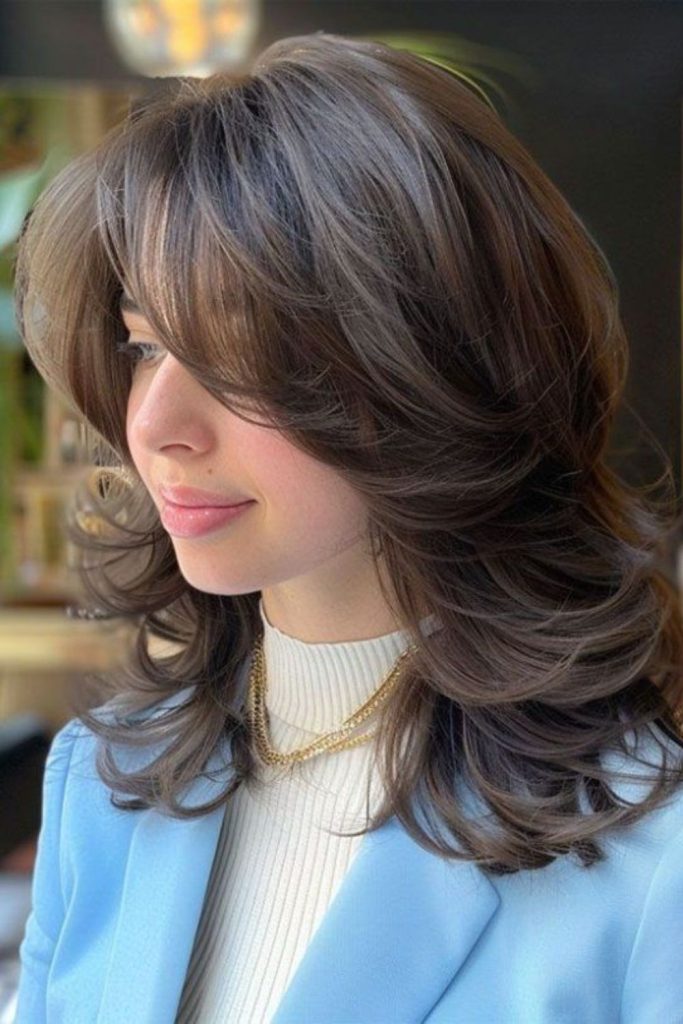 Feathered shoulder flip layered hairstyle women