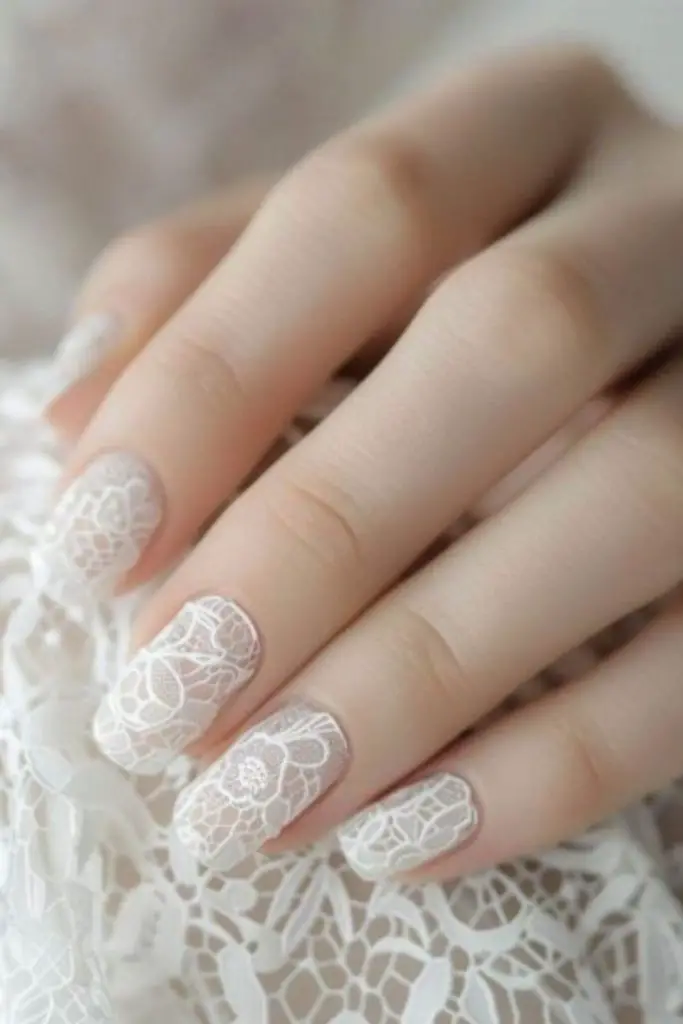 Icy white delicate lace nails