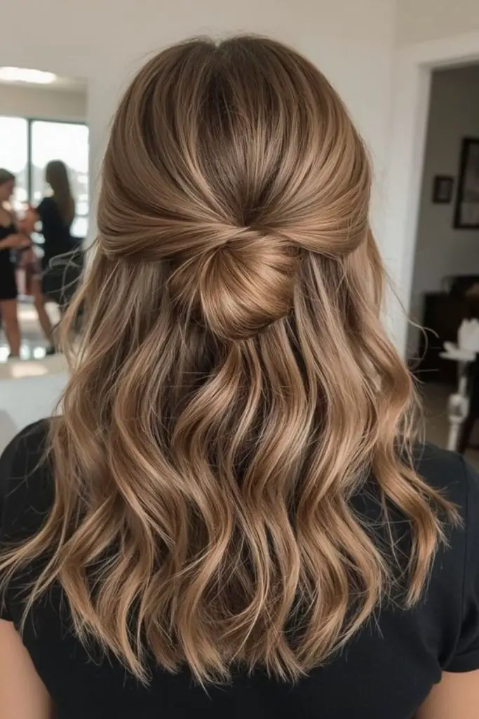 Half up bun with loose hair.