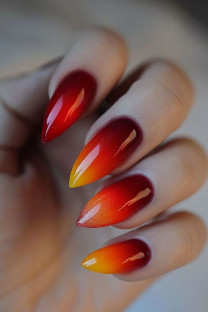 Molten red and orange flowing nails
