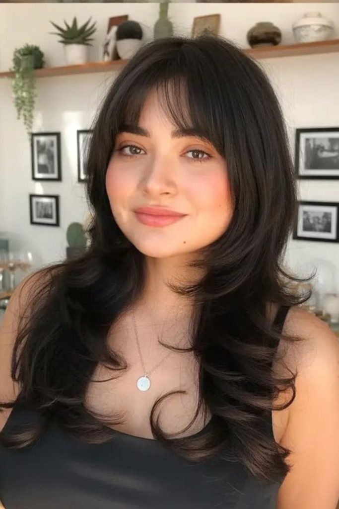 Long layered curtain bangs hairstyle