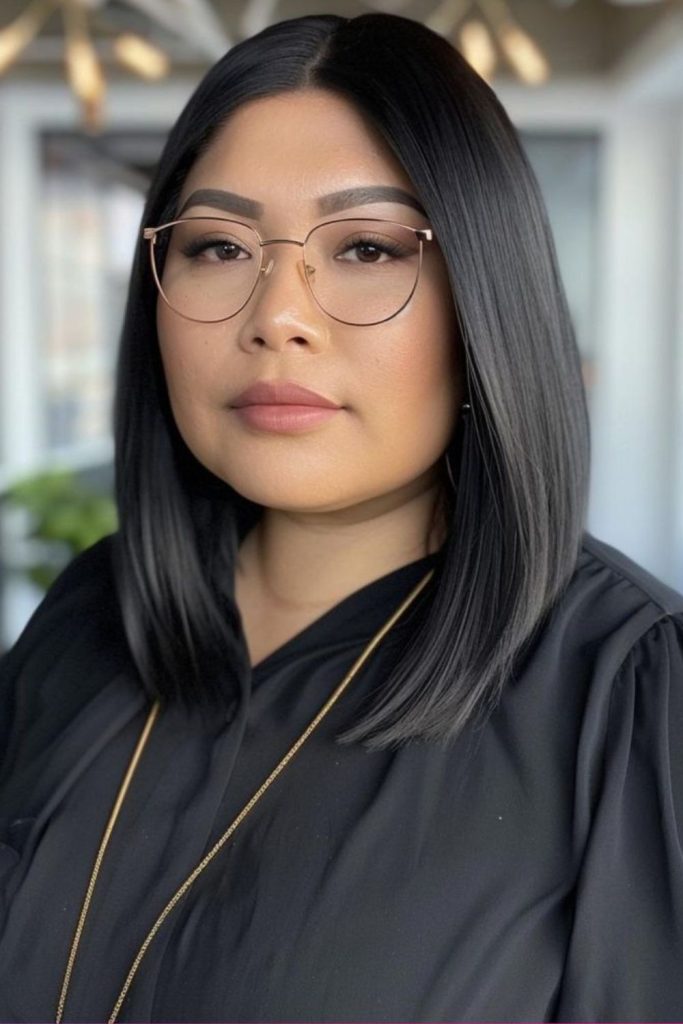 Mid-part straight sleek style elongates profile