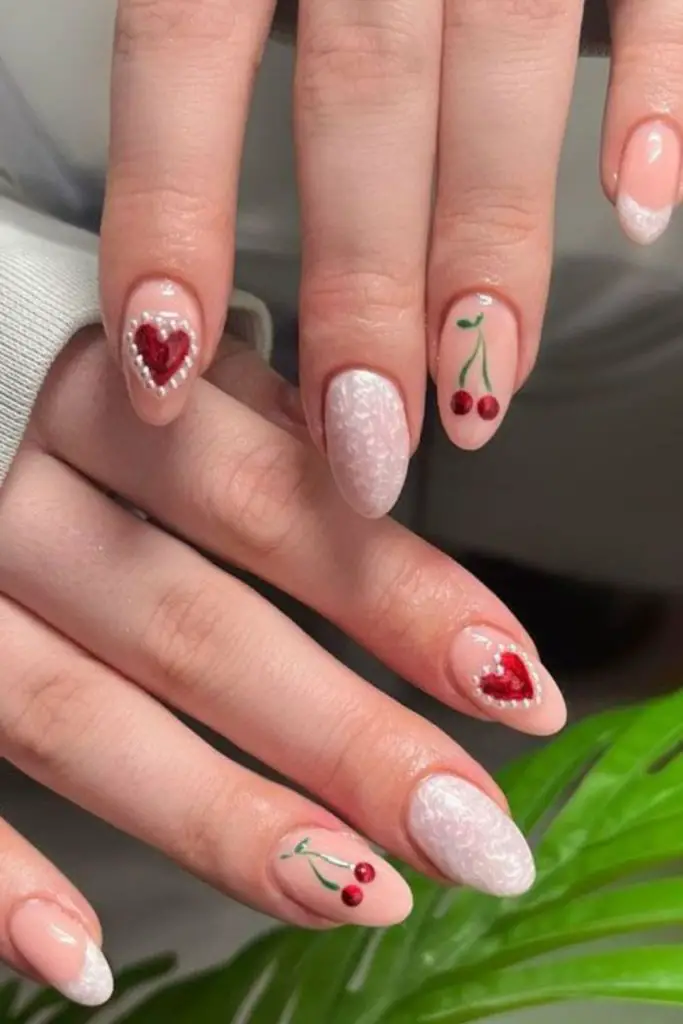Cherry red nails with pearl accents