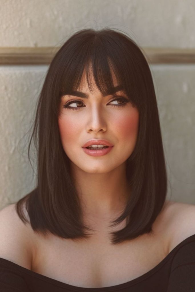 Polished lob hairstyle with rounded fringe