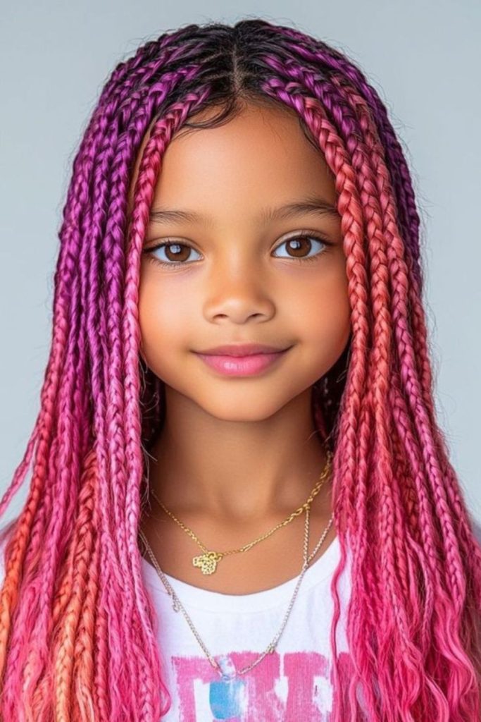 Ombre rainbow braids blending bright colors.