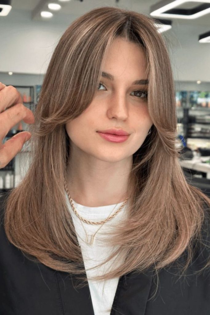 Sleek middle part curtain bangs