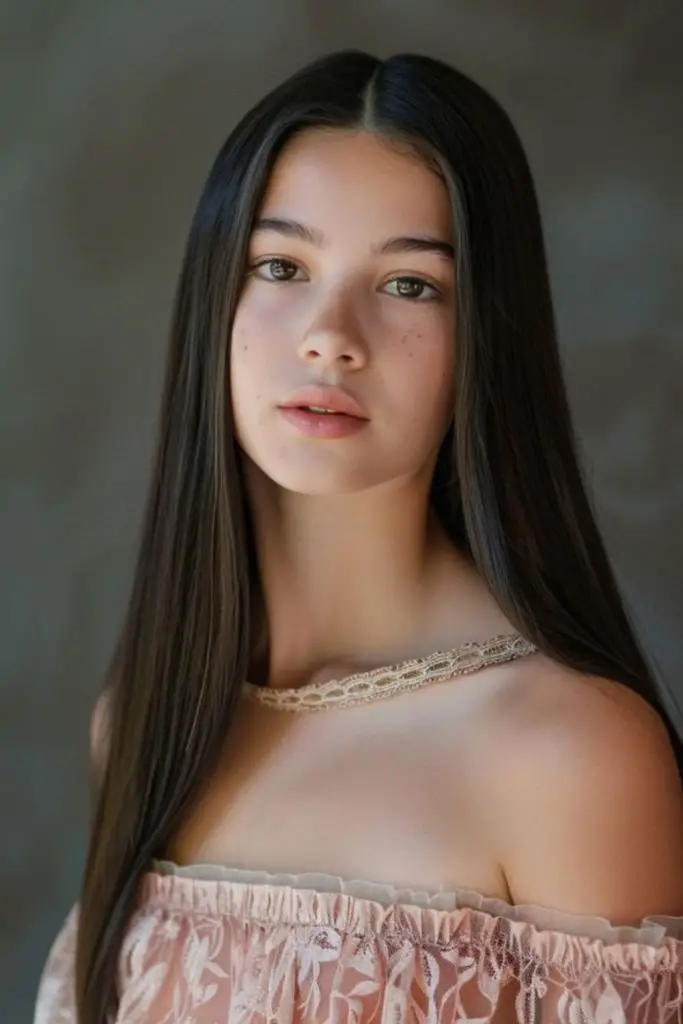 Smooth straight hair center parted.