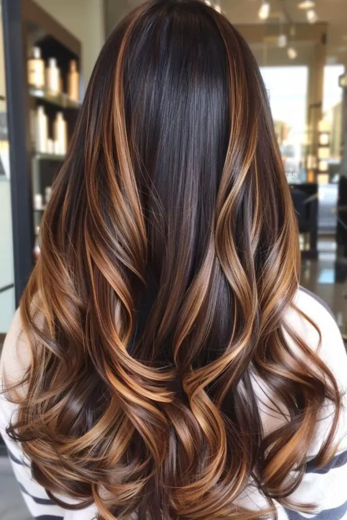 Maple caramel flickers on dark hair