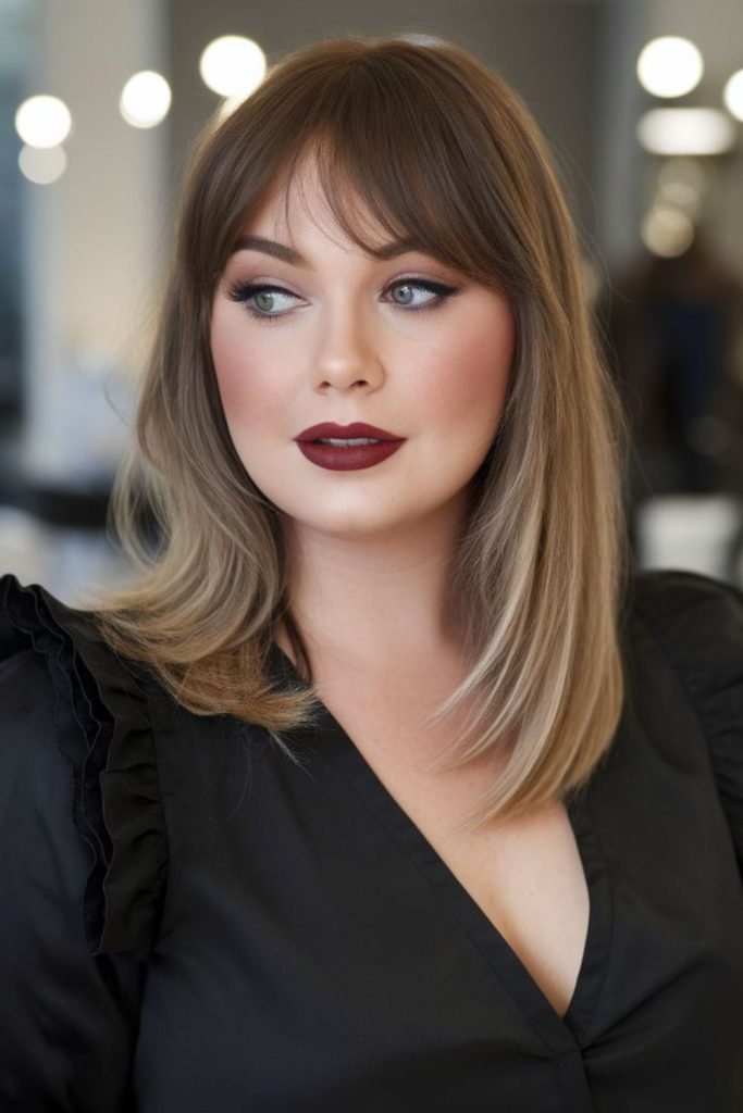 Wispy bangs soften wider facial features