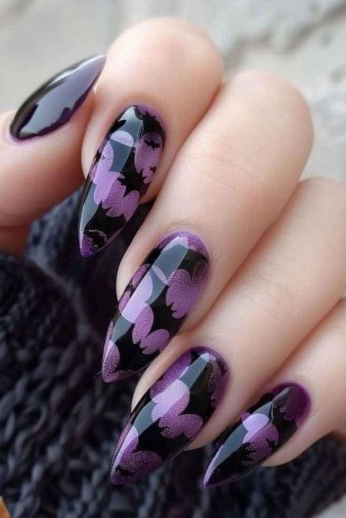 Batwing glam purple gothic nail art.