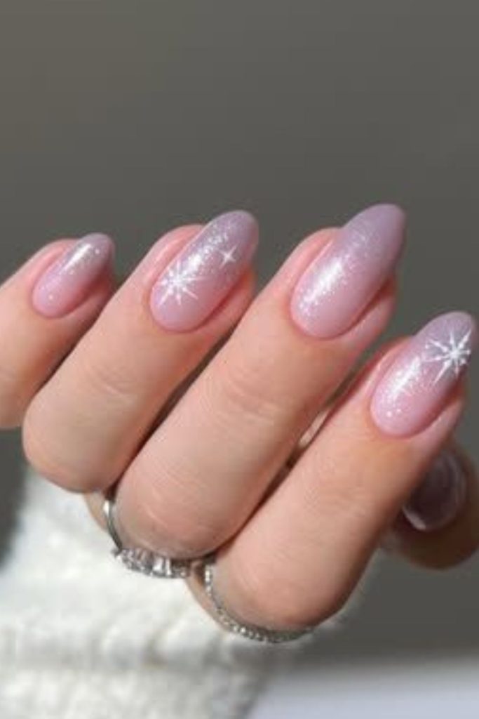 Pink nails with glitter drip effect.